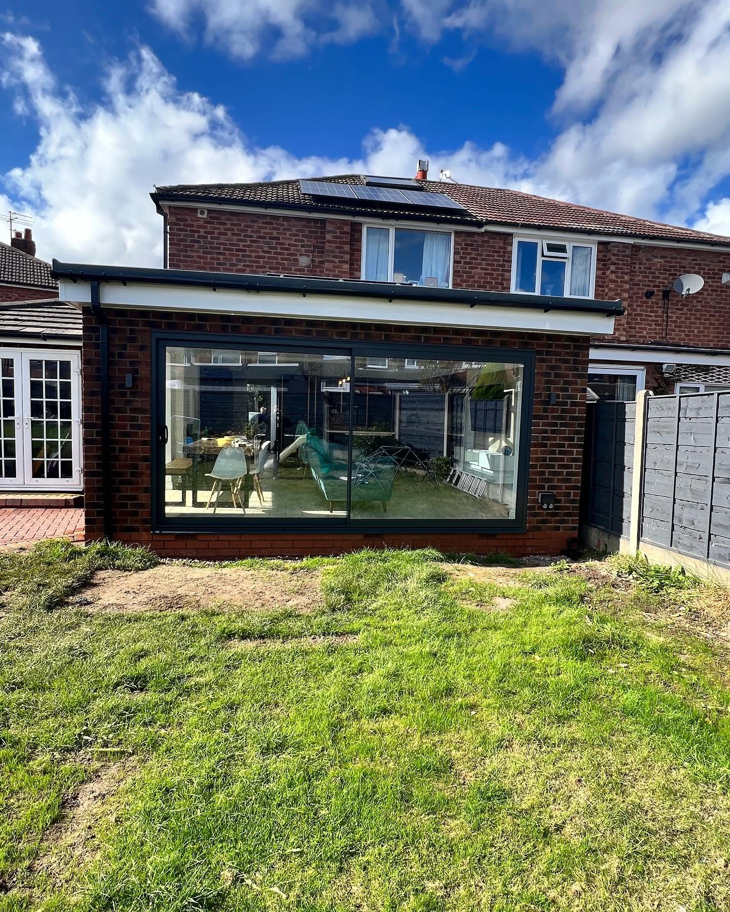 Rear elevation of a completed full-width house extension